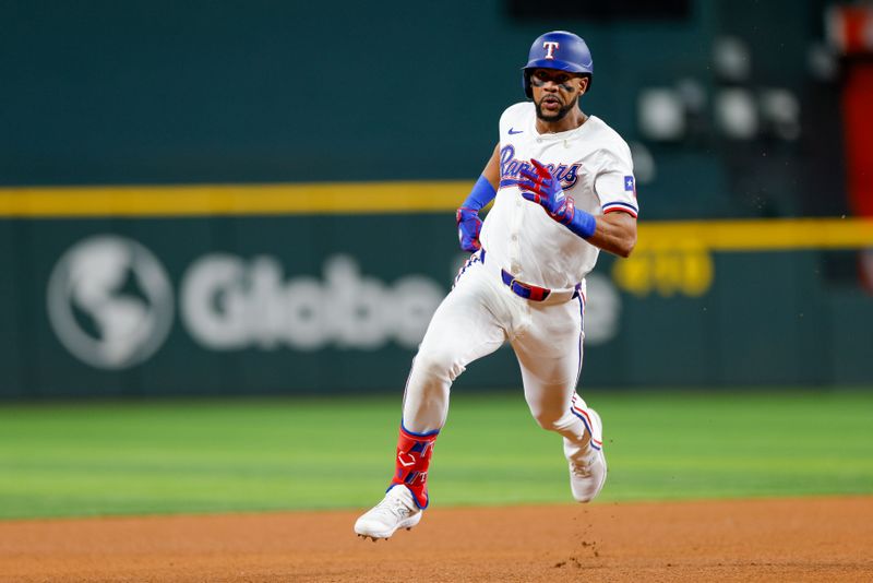 May 15, 2024; Arlington, Texas, USA; Texas Rangers outfielder Leody Taveras (3) hits a triple during the fifth inning against the Cleveland Guardians at Globe Life Field. Mandatory Credit: Andrew Dieb-USA TODAY Sports