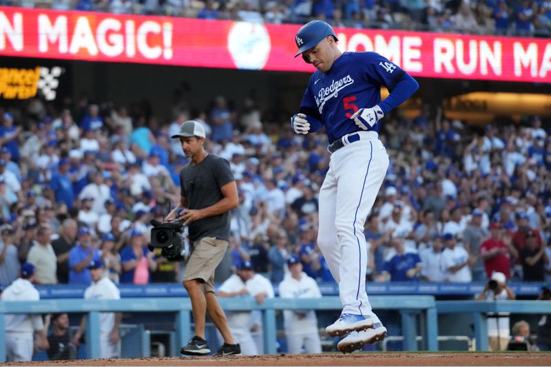 Jul 25, 2023; Los Angeles, California, USA; Los Angeles Dodgers first baseman Freddie Freeman (5) crosses home plate after hitting a solo home run in the first inning against the Toronto Blue Jays at Dodger Stadium. Mandatory Credit: Kirby Lee-USA TODAY Sports