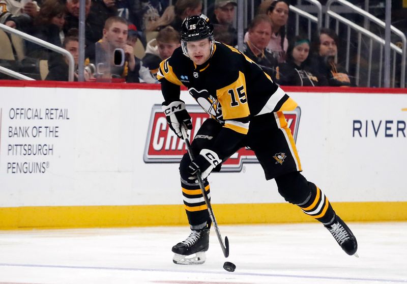 Mar 5, 2024; Pittsburgh, Pennsylvania, USA; Pittsburgh Penguins left wing Joona Koppanen (15) skates with the puck against the Columbus Blue Jackets during the third period at PPG Paints Arena. The Penguins won 5-3. Mandatory Credit: Charles LeClaire-USA TODAY Sports