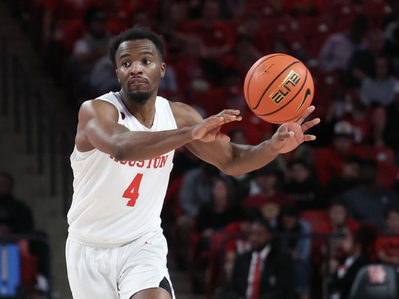 Nov 24, 2023; Houston, Texas, USA;  Houston Cougars guard LJ Cryer (4) passes the ball against the Montana Grizzlies in the second half at Fertitta Center. Mandatory Credit: Thomas Shea-USA TODAY Sports