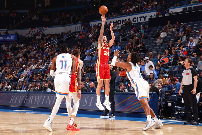 OKLAHOMA CITY, OK - OCTOBER 17: Garrison Mathews #24 of the Atlanta Hawks shoots a three point basket at the game against Oklahoma City Thunder on October 17, 2024 at Paycom Arena in Oklahoma City, Oklahoma. NOTE TO USER: User expressly acknowledges and agrees that, by downloading and or using this photograph, User is consenting to the terms and conditions of the Getty Images License Agreement. Mandatory Copyright Notice: Copyright 2024 NBAE (Photo by Zach Beeker/NBAE via Getty Images)