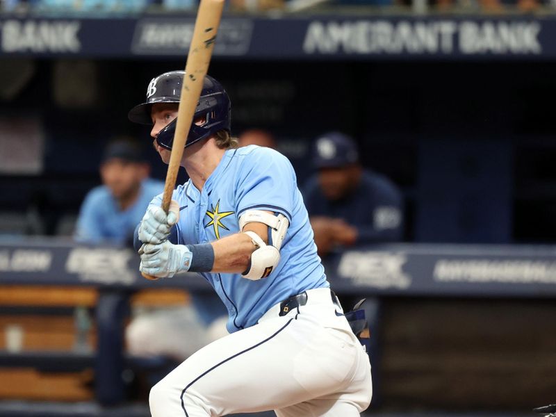 Jul 31, 2024; St. Petersburg, Florida, USA;  Tampa Bay Rays outfielder Jonny DeLuca (21) hits an RBI triple against the Miami Marlins during the second inning at Tropicana Field. Mandatory Credit: Kim Klement Neitzel-USA TODAY Sports