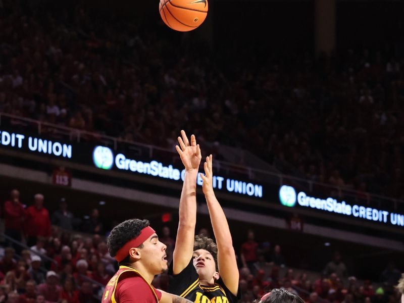 Dec 11, 2025; Ames, Iowa, USA;  Iowa Hawkeyes forward Trey Thompson (20) shoots over Iowa State Cyclones guard Tamin Lipsey (3) during the second half at James H. Hilton Coliseum. Mandatory Credit: Reese Strickland-Imagn Images