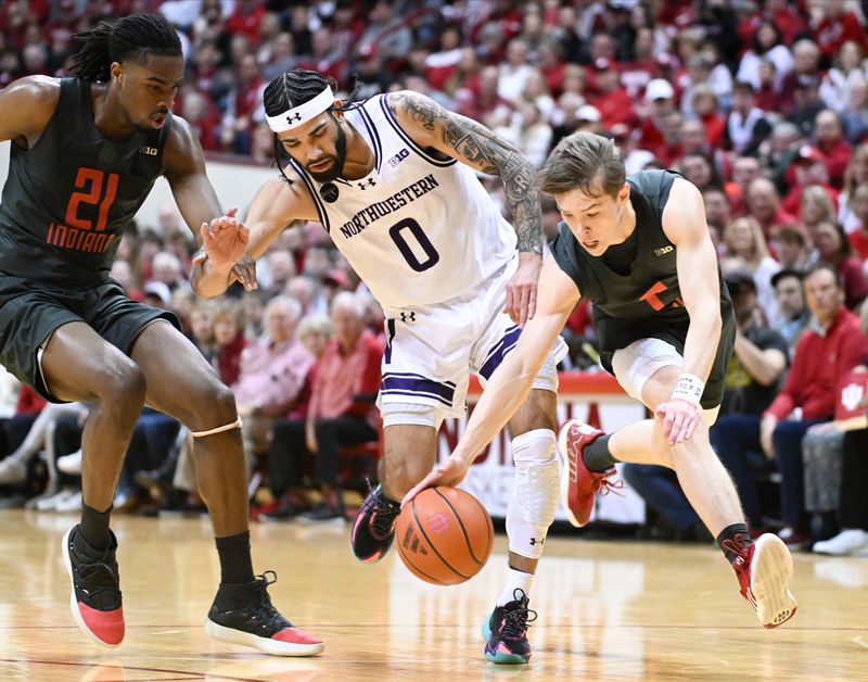 Feb 18, 2024; Bloomington, Indiana, USA;  Indiana Hoosiers guard Gabe Cupps (2) and Indiana Hoosiers forward Mackenzie Mgbako (21) and Northwestern Wildcats guard Boo Buie (0) go after a loose ball during the second half at Simon Skjodt Assembly Hall. Mandatory Credit: Robert Goddin-USA TODAY Sports