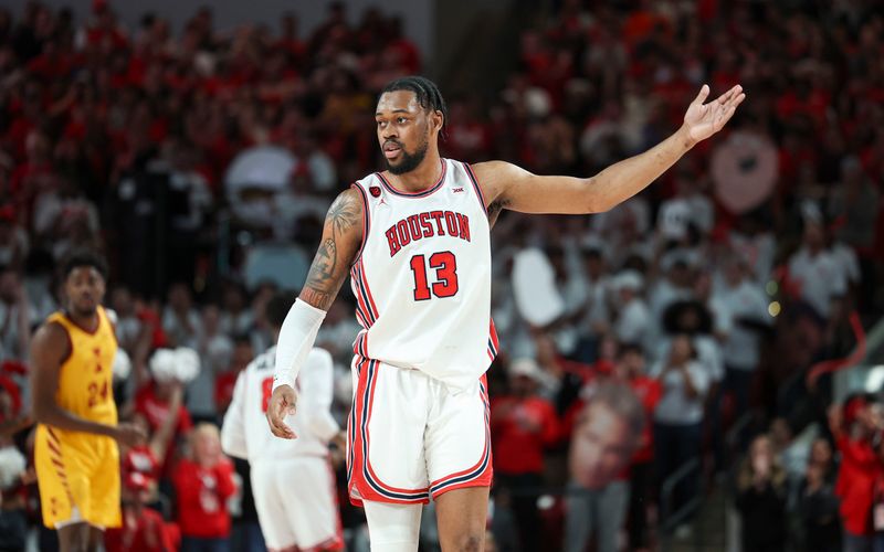 Feb 19, 2024; Houston, Texas, USA; Houston Cougars forward J'Wan Roberts (13) reacts after a play during the second half against the Iowa State Cyclones at Fertitta Center. Mandatory Credit: Troy Taormina-USA TODAY Sports