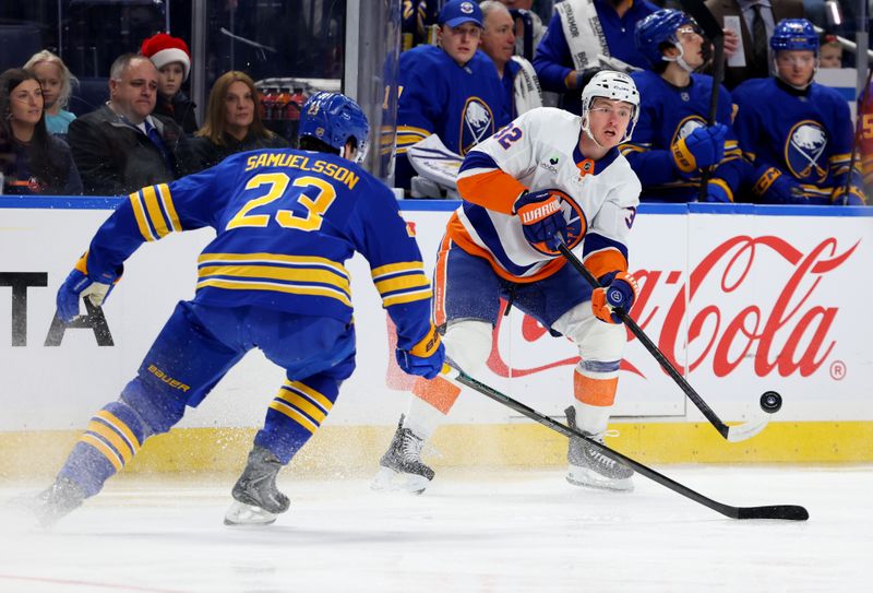 Dec 20, 2025; Buffalo, New York, USA;  Buffalo Sabres defenseman Mattias Samuelsson (23) tries to block a pass by New York Islanders center Kyle MacLean (32) d1p at KeyBank Center. Mandatory Credit: Timothy T. Ludwig-Imagn Images