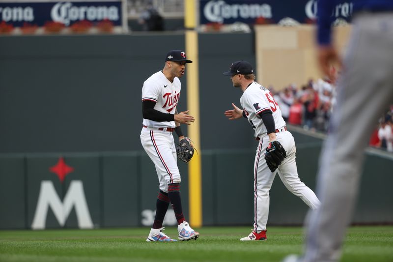 Oct 4, 2023; Minneapolis, Minnesota, USA; Minnesota Twins shortstop Carlos Correa (4) celebrates a play with starting pitcher Sonny Gray (54) in the fifth inning  against the Toronto Blue Jays during game two of the Wildcard series for the 2023 MLB playoffs at Target Field. Mandatory Credit: Jesse Johnson-USA TODAY Sports