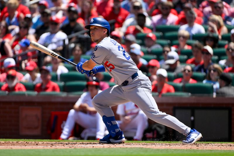 Jun 8, 2025; St. Louis, Missouri, USA;  Los Angeles Dodgers second baseman Tommy Edman (25) hits a one run double against the St. Louis Cardinals during the fourth inning at Busch Stadium. Mandatory Credit: Jeff Curry-Imagn Images