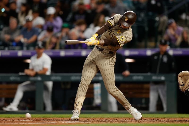 Apr 24, 2024; Denver, Colorado, USA; San Diego Padres center fielder Jackson Merrill (3) hits a ground out RBI in the sixth inning against the Colorado Rockies at Coors Field. Mandatory Credit: Isaiah J. Downing-USA TODAY Sports