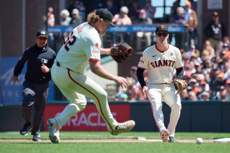 Aug 10, 2024; San Francisco, California, USA; San Francisco Giants infielder Mark Canha (16) watches as starting pitcher Logan Webb (62) fields a ground ball against the Detroit Tigers during the seventh inning at Oracle Park. Mandatory Credit: Robert Edwards-USA TODAY Sports