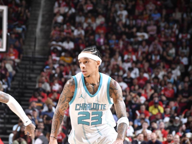 HOUSTON, TX - OCTOBER 23:  Tre Mann #23 of the Charlotte Hornets dribbles the ball during the game against the Houston Rockets during a regular season game on October 23, 2024 at the Toyota Center in Houston, Texas. NOTE TO USER: User expressly acknowledges and agrees that, by downloading and or using this photograph, User is consenting to the terms and conditions of the Getty Images License Agreement. Mandatory Copyright Notice: Copyright 2024 NBAE (Photo by Logan Riely/NBAE via Getty Images)