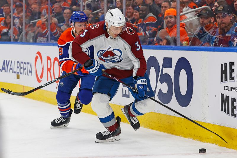 Mar 16, 2024; Edmonton, Alberta, CAN; Colorado Avalanche defensemen Jack Johnson (3) tries to clear the puck in front of Edmonton Oilers forward Sam Carrick (39). during the first period at Rogers Place. Mandatory Credit: Perry Nelson-USA TODAY Sports