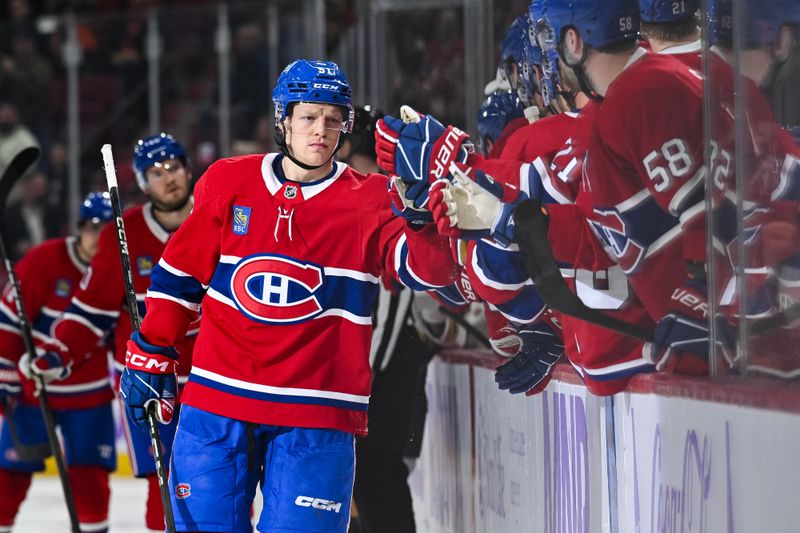 Nov 23, 2024; Montreal, Quebec, CAN; Montreal Canadiens left wing Emil Heineman (51) celebrates his goal against the Las Vegas Golden Knights with his teammates at the bench during the third period at Bell Centre. Mandatory Credit: David Kirouac-Imagn Images