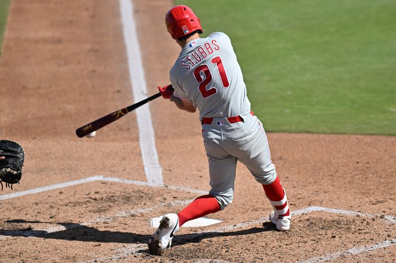 Feb 28, 2026; Dunedin, Florida, USA; Philadelphia Phillies catcher Garrett Stubbs (21) hits into a fielders choice  in the third inning against the Toronto Blue Jays during spring training at TD Ballpark. Mandatory Credit: Jonathan Dyer-Imagn Images
