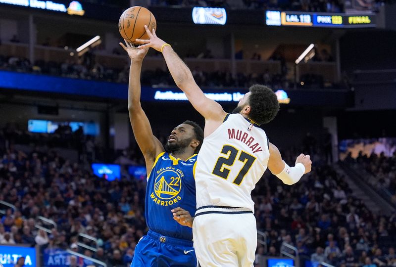 SAN FRANCISCO, CALIFORNIA - FEBRUARY 25: Jamal Murray #27 of the Denver Nuggets blocks the shot of Andrew Wiggins #22 of the Golden State Warriors in the third quarter at Chase Center on February 25, 2024 in San Francisco, California. NOTE TO USER: User expressly acknowledges and agrees that, by downloading and or using this photograph, User is consenting to the terms and conditions of the Getty Images License Agreement. (Photo by Thearon W. Henderson/Getty Images)