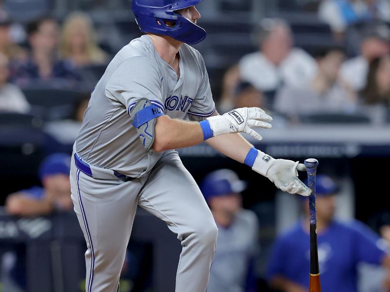 Aug 2, 2024; Bronx, New York, USA; Toronto Blue Jays designated hitter Spencer Horwitz (48) watches his RBI single against the New York Yankees during the third inning at Yankee Stadium. Mandatory Credit: Brad Penner-USA TODAY Sports