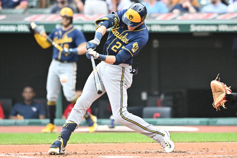 Jun 25, 2023; Cleveland, Ohio, USA; Milwaukee Brewers designated hitter Christian Yelich (22) hits an RBI double during the third inning against the Cleveland Guardians at Progressive Field. Mandatory Credit: Ken Blaze-USA TODAY Sports