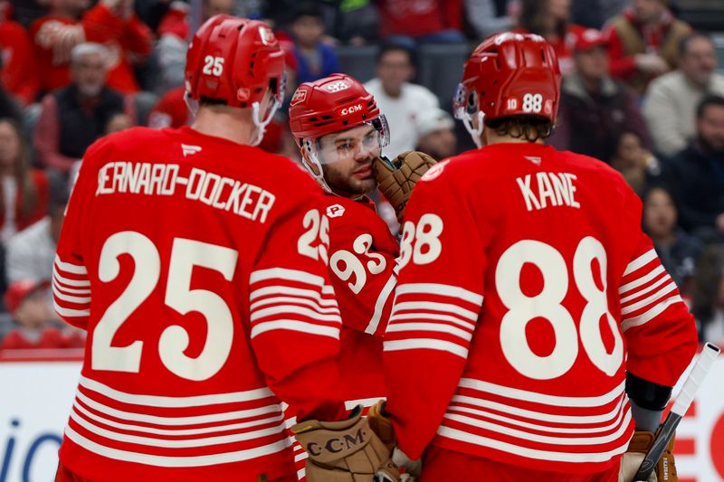 Mar 21, 2026; Detroit, Michigan, USA; Detroit Red Wings right wing Alex DeBrincat (93) talks with right wing Patrick Kane (88) and defenseman Jacob Bernard-Docker (25) during the first period against the Boston Bruins at Little Caesars Arena. Mandatory Credit: Brian Bradshaw Sevald-Imagn Images