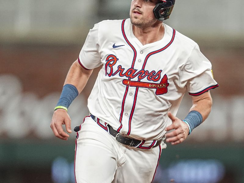 May 29, 2024; Cumberland, Georgia, USA; Atlanta Braves third baseman Austin Riley (27) runs the bases against the Washington Nationals during the sixth inning at Truist Park. Mandatory Credit: Dale Zanine-USA TODAY Sports