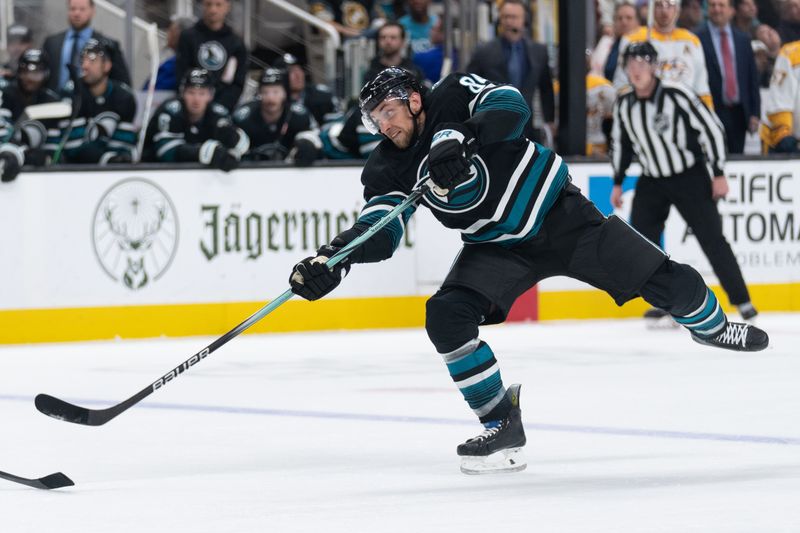 Feb 24, 2024; San Jose, California, USA; San Jose Sharks defenseman Jan Rutta (84) shoots during the second period against the Nashville Predators at SAP Center at San Jose. Mandatory Credit: Stan Szeto-USA TODAY Sports