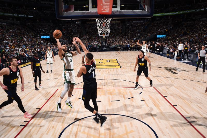 DENVER, CO - MARCH 7: Jayson Tatum #0 of the Boston Celtics drives to the basket during the game against the Denver Nuggets on March 7, 2024 at the Ball Arena in Denver, Colorado. NOTE TO USER: User expressly acknowledges and agrees that, by downloading and/or using this Photograph, user is consenting to the terms and conditions of the Getty Images License Agreement. Mandatory Copyright Notice: Copyright 2024 NBAE (Photo by Garrett Ellwood/NBAE via Getty Images)