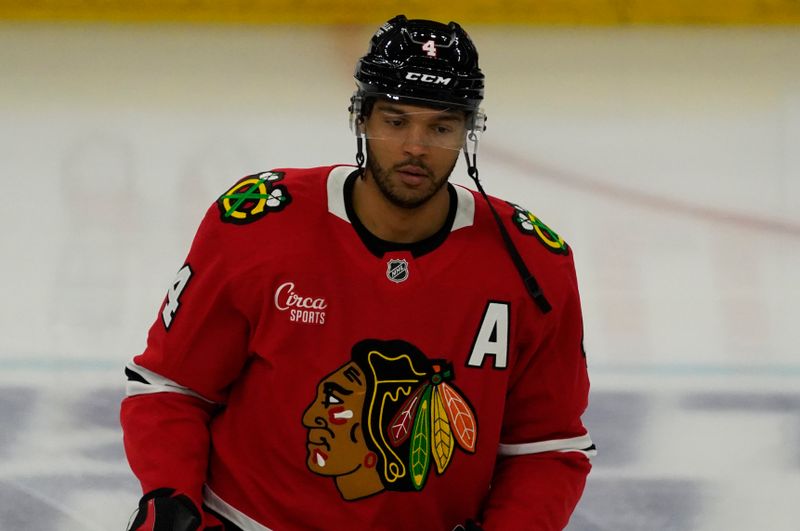 Oct 25, 2024; Chicago, Illinois, USA; Chicago Blackhawks defenseman Seth Jones (4) warms up before a game against the Nashville Predators at United Center. Mandatory Credit: David Banks-Imagn Images