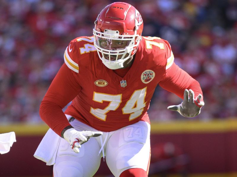 Kansas City Chiefs offensive tackle Jawaan Taylor prepares to block during the first half of an NFL football game against the Chicago Bears, Sunday, Sept. 24, 2023 in Kansas City, Mo. (AP Photo/Reed Hoffmann)