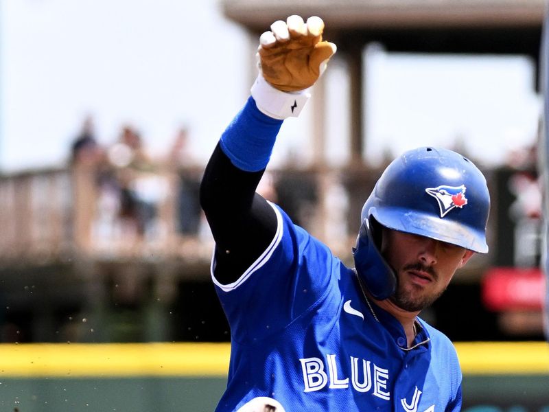 Mar 25, 2024; Bradenton, Florida, USA; Toronto Blue Jays second baseman Cavan Biggio (8) slides into third base for a RBI triple in the second inning of the spring training game against the Pittsburgh Pirates at LECOM Park. Mandatory Credit: Jonathan Dyer-USA TODAY Sports