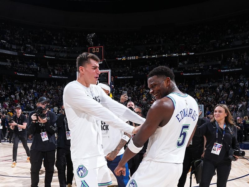 DENVER, CO - MAY 19:  Luka Garza #55 of the Minnesota Timberwolves and Anthony Edwards #5 of the Minnesota Timberwolves embrace after the game against the Denver Nuggets during Round 2 Game 7 of the 2024 NBA Playoffs  on May 19, 2024 at the Ball Arena in Denver, Colorado. NOTE TO USER: User expressly acknowledges and agrees that, by downloading and/or using this Photograph, user is consenting to the terms and conditions of the Getty Images License Agreement. Mandatory Copyright Notice: Copyright 2024 NBAE (Photo by Garrett Ellwood/NBAE via Getty Images)