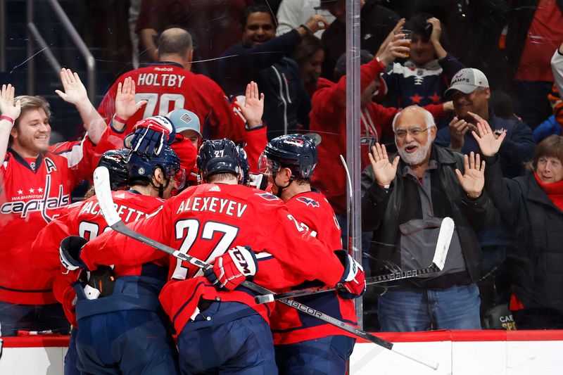 Mar 1, 2024; Washington, District of Columbia, USA; Washington Capitals center Dylan Strome (17) celebrates with teammates after scoring a goal against the Philadelphia Flyers in the third period at Capital One Arena. Mandatory Credit: Geoff Burke-USA TODAY Sports