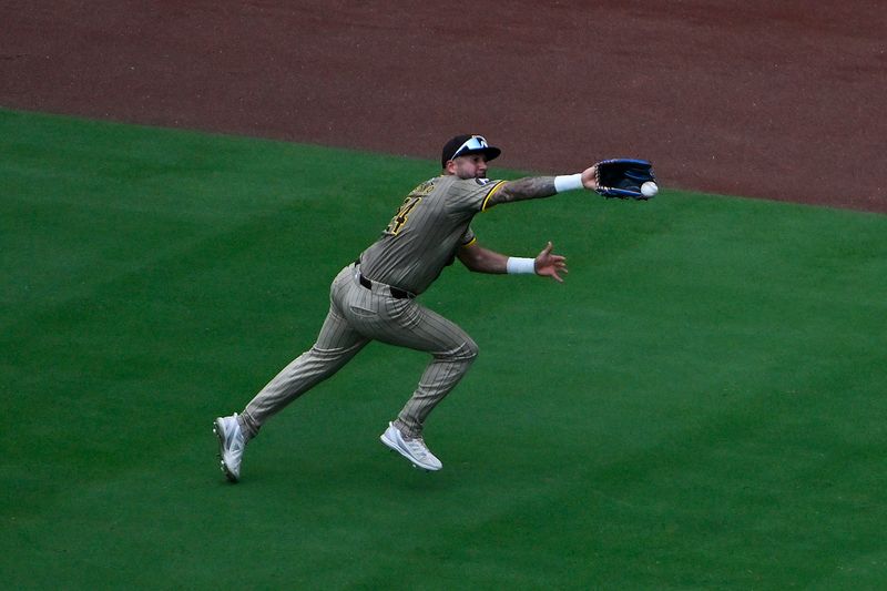 Aug 29, 2024; St. Louis, Missouri, USA;  San Diego Padres right fielder David Peralta (24) is unable to catch a triple hit by St. Louis Cardinals right fielder Lars Nootbaar (not pictured) during the eighth inning at Busch Stadium. Mandatory Credit: Jeff Curry-USA TODAY Sports