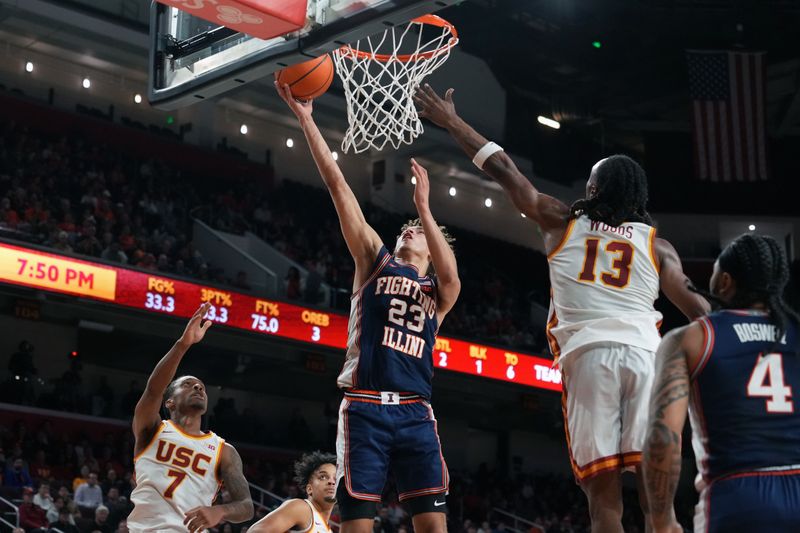 Feb 18, 2026; Los Angeles, California, USA; Illinois Fighting Illini guard Keaton Wagler (23) shoots the ball against Southern California Trojans guard Jordan Marsh (7) and guard Cam Woods (13) in the first half at Galen Center. Mandatory Credit: Kirby Lee-Imagn Images