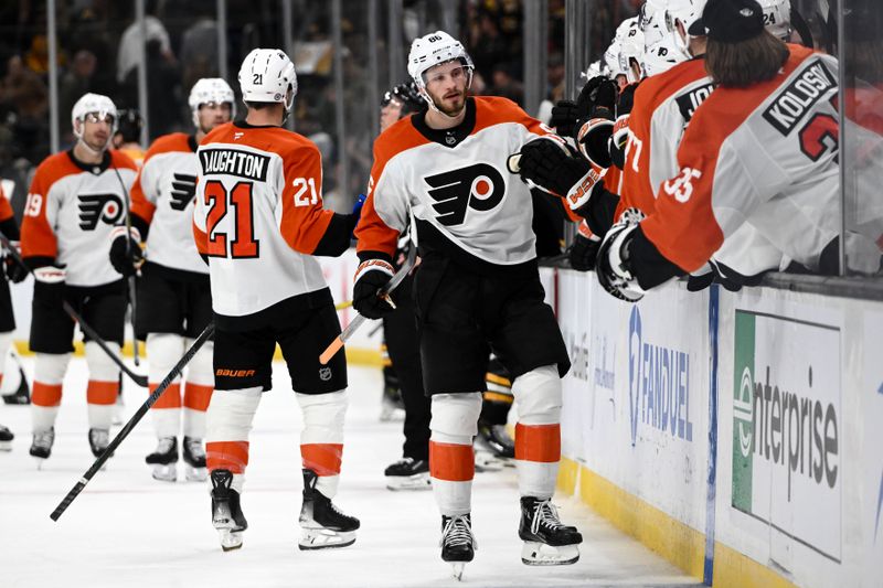 Oct 29, 2024; Boston, Massachusetts, USA; Philadelphia Flyers left wing Joel Farabee (86) celebrates with his teammates after scoring an empty net goal against the Boston Bruins during the third period at TD Garden. Mandatory Credit: Brian Fluharty-Imagn Images