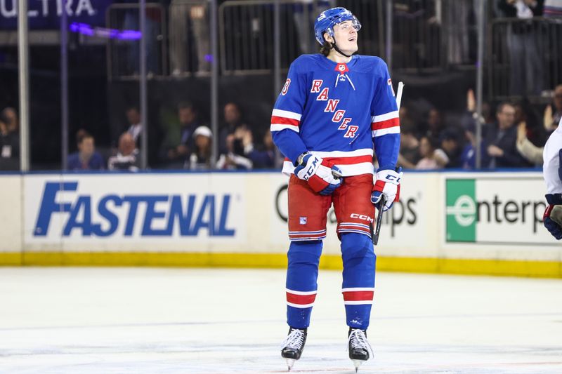 Apr 21, 2024; New York, New York, USA; New York Rangers center Matt Rempe (73) looks at the scoreboard after scoring a goal in the second period against the Washington Capitals in game one of the first round of the 2024 Stanley Cup Playoffs at Madison Square Garden. Mandatory Credit: Wendell Cruz-USA TODAY Sports