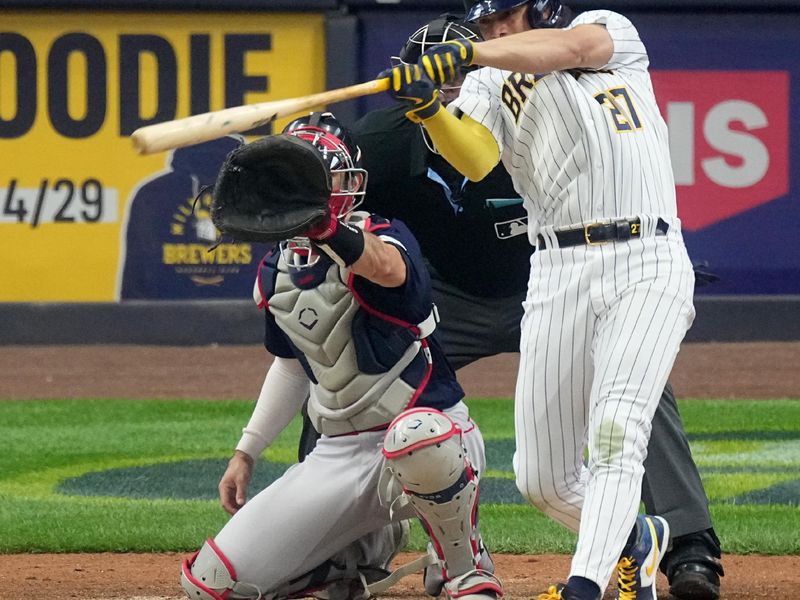 Apr 23, 2023; Milwaukee, Wisconsin, USA; Milwaukee Brewers shortstop Willy Adames (27) hits a sacrifice fly during the fifth inning of their game against the Boston Red Sox at American Family Field. Mandatory Credit: Mark Hoffman-USA TODAY Sports