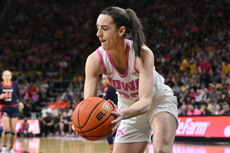 Feb 25, 2024; Iowa City, Iowa, USA; Iowa Hawkeyes guard Caitlin Clark (22) grabs a loose ball during the first quarter against the Illinois Fighting Illini at Carver-Hawkeye Arena. Mandatory Credit: Jeffrey Becker-USA TODAY Sports