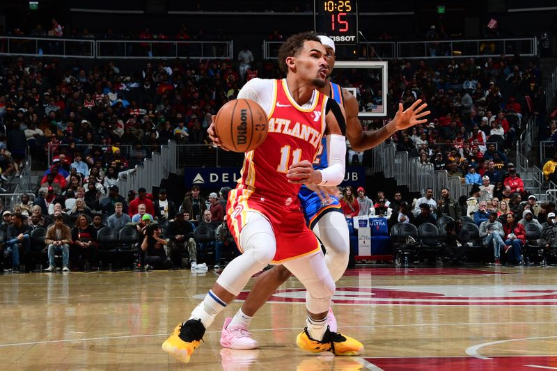 ATLANTA, GA - JANUARY 3:  Trae Young #11 of the Atlanta Hawks handles the ball during the game against the Oklahoma City Thunder on January 3, 2024 at State Farm Arena in Atlanta, Georgia.  NOTE TO USER: User expressly acknowledges and agrees that, by downloading and/or using this Photograph, user is consenting to the terms and conditions of the Getty Images License Agreement. Mandatory Copyright Notice: Copyright 2024 NBAE (Photo by Scott Cunningham/NBAE via Getty Images)