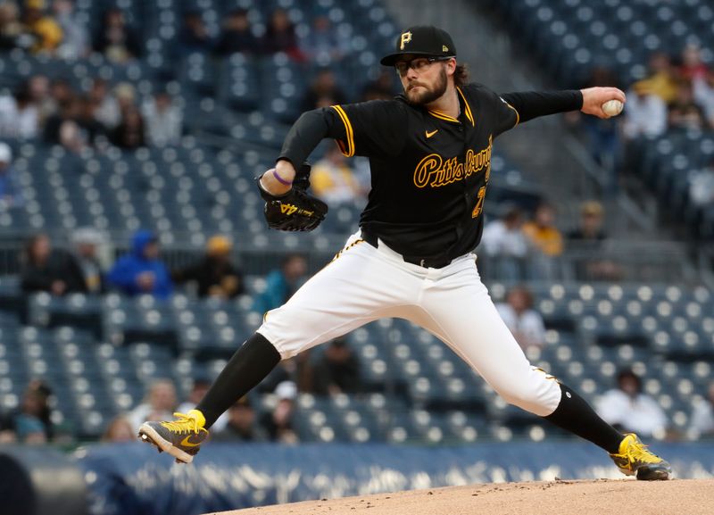 Apr 24, 2024; Pittsburgh, Pennsylvania, USA;  Pittsburgh Pirates starting pitcher Josh Fleming (28) delivers a pitch against the Milwaukee Brewers during the first inning at PNC Park. Mandatory Credit: Charles LeClaire-USA TODAY Sports