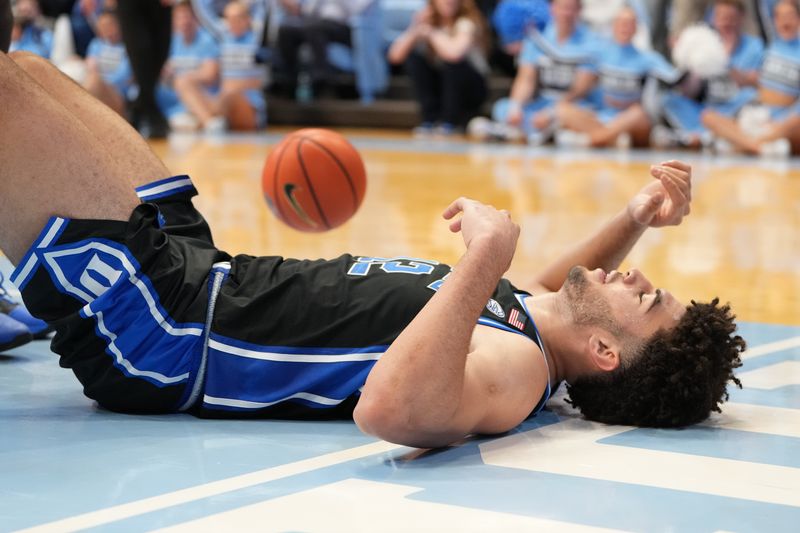 Feb 7, 2026; Chapel Hill, North Carolina, USA; Duke Blue Devils forward Cameron Boozer (12) on the floor in the second  half at Dean E. Smith Center. Mandatory Credit: Bob Donnan-Imagn Images