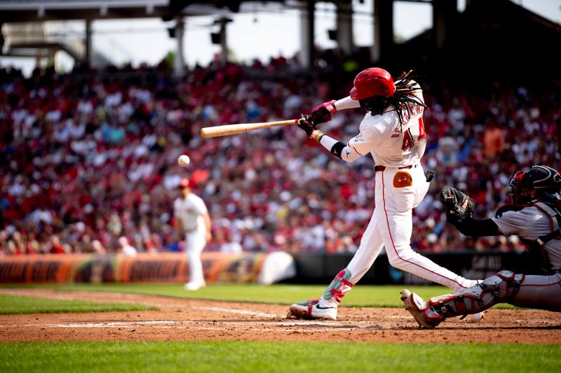 Jun 22, 2024; Cincinnati, Ohio, USA; Cincinnati Reds shortstop Elly De La Cruz (44) hits a base hit in the fifth inning of the MLB baseball game between the Cincinnati Reds and the Boston Red Sox at Great American Ball Park in Cincinnati on Saturday, June 22, 2024. Mandatory Credit: Albert Cesare-The Cincinnati Enquirer-USA TODAY Sports