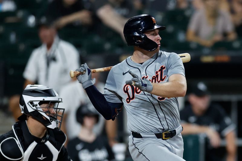 Aug 26, 2024; Chicago, Illinois, USA; Detroit Tigers second baseman Colt Keith (33) hits an RBI-single against the Chicago White Sox during the fifth inning at Guaranteed Rate Field. Mandatory Credit: Kamil Krzaczynski-USA TODAY Sports