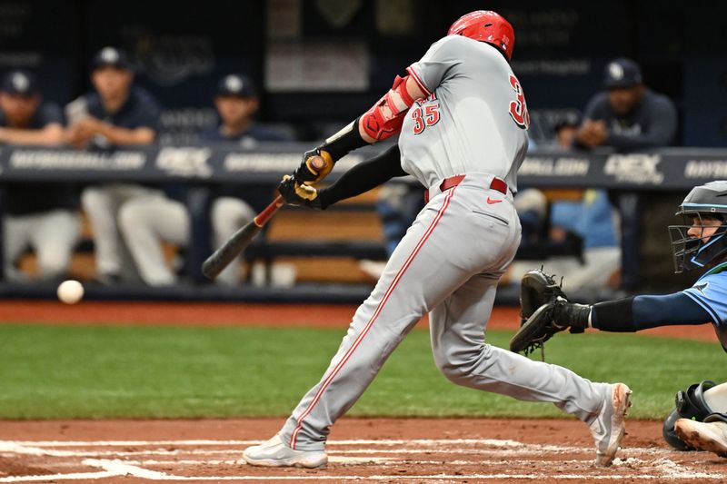 Jul 28, 2024; St. Petersburg, Florida, USA; Cincinnati Reds designated hitter Tyler Stephenson (37) hits a RBI single in the second inning against the Tampa Bay Rays at Tropicana Field. Mandatory Credit: Jonathan Dyer-USA TODAY Sports