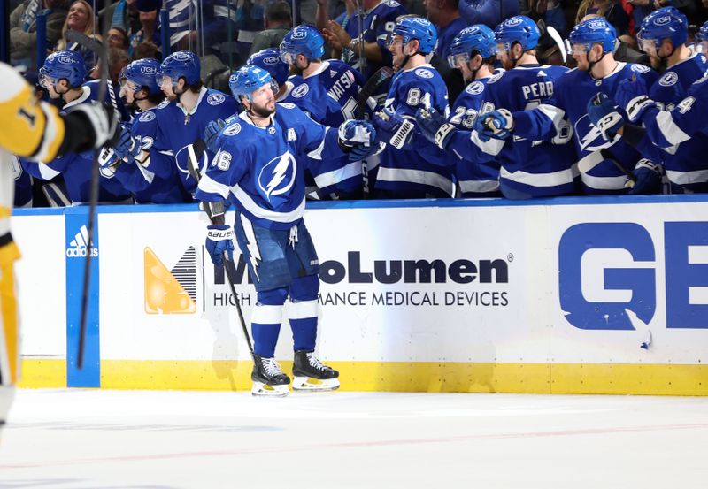 Dec 6, 2023; Tampa, Florida, USA; Tampa Bay Lightning right wing Nikita Kucherov (86) is congratulated after he scored a goal against the Pittsburgh Penguins  during the second period at Amalie Arena. Mandatory Credit: Kim Klement Neitzel-USA TODAY Sports