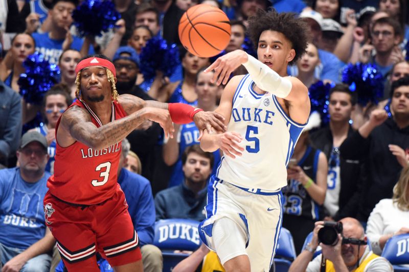 Feb 20, 2023; Durham, North Carolina, USA; Duke Blue Devils guard Tyrese Proctor(5) throws a pass ahead of Louisville Cardinals guard El Ellis (3) during the first half at Cameron Indoor Stadium. Mandatory Credit: Rob Kinnan-USA TODAY Sports