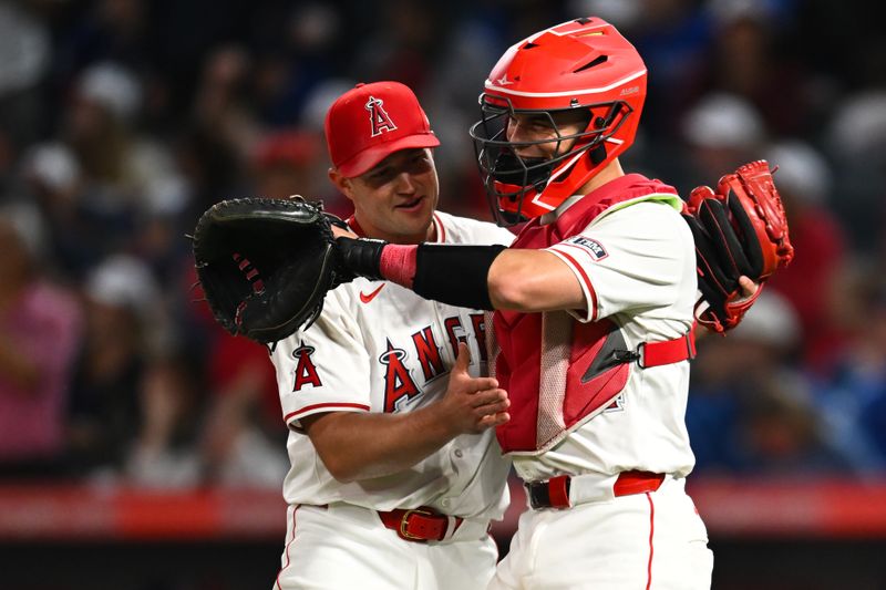 May 11, 2024; Anaheim, California, USA; Los Angeles Angels pitcher Carson Fulmer (41) celebrates with catcher Logan O'Hoppe (14) after defeating the Kansas City Royals at Angel Stadium. Mandatory Credit: Jonathan Hui-USA TODAY Sports