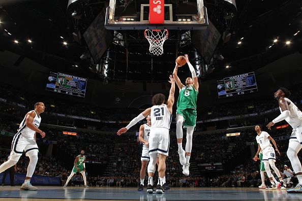 MEMPHIS, TN - NOVEMBER 19: Kristaps Porzingis #8 of the Boston Celtics drives to the basket during the game against the Memphis Grizzlies on November 19, 2023 at FedExForum in Memphis, Tennessee. NOTE TO USER: User expressly acknowledges and agrees that, by downloading and or using this photograph, User is consenting to the terms and conditions of the Getty Images License Agreement. Mandatory Copyright Notice: Copyright 2023 NBAE (Photo by Joe Murphy/NBAE via Getty Images)