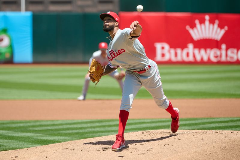 Jun 17, 2023; Oakland, California, USA; Philadelphia Phillies pitcher Cristopher Sanchez (61) throws a pitch against the Oakland Athletics during the first inning at Oakland-Alameda County Coliseum. Mandatory Credit: Robert Edwards-USA TODAY Sports