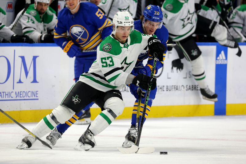 Mar 9, 2023; Buffalo, New York, USA;  Dallas Stars center Wyatt Johnston (53) controls the puck as Buffalo Sabres center Tage Thompson (72) defends during the third period at KeyBank Center. Mandatory Credit: Timothy T. Ludwig-USA TODAY Sports