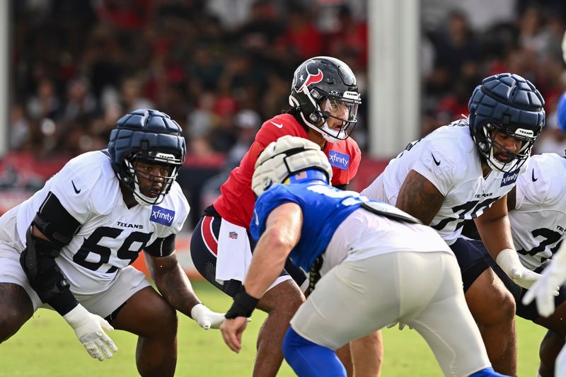 Houston Texans quarterback C.J. Stroud starts a play against the Los Angeles Rams during an NFL football preseason joint practice, Thursday, Aug 22, 2024, in Houston. (AP Photo/Maria Lysaker)