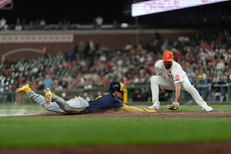 Sep 10, 2024; San Francisco, California, USA;  Milwaukee Brewers third base Joey Ortiz (3) dives towards home plate during the seventh inning against San Francisco Giants pitcher Tristan Beck (43) at Oracle Park. Mandatory Credit: Stan Szeto-Imagn Images